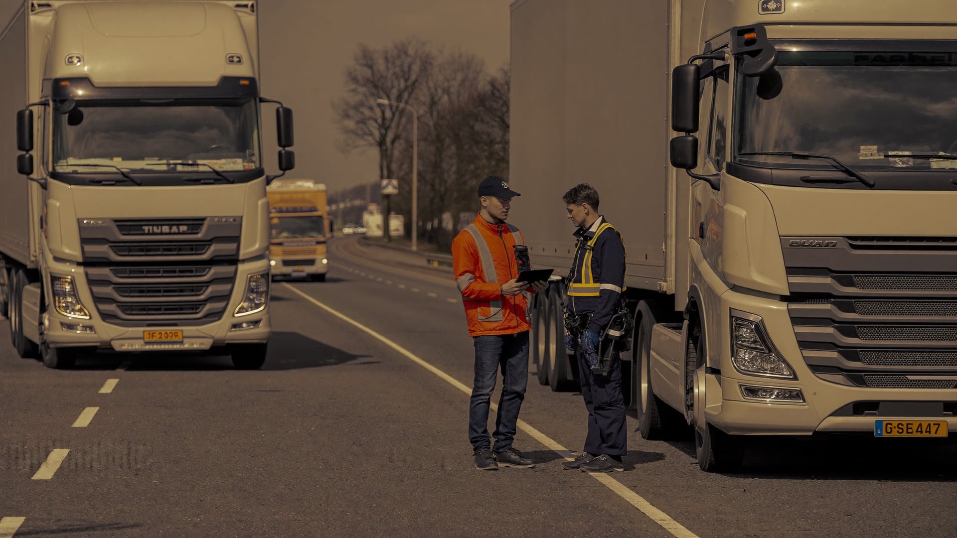 A truck passes a clean roadside inspection with a thumbs-up from the officer